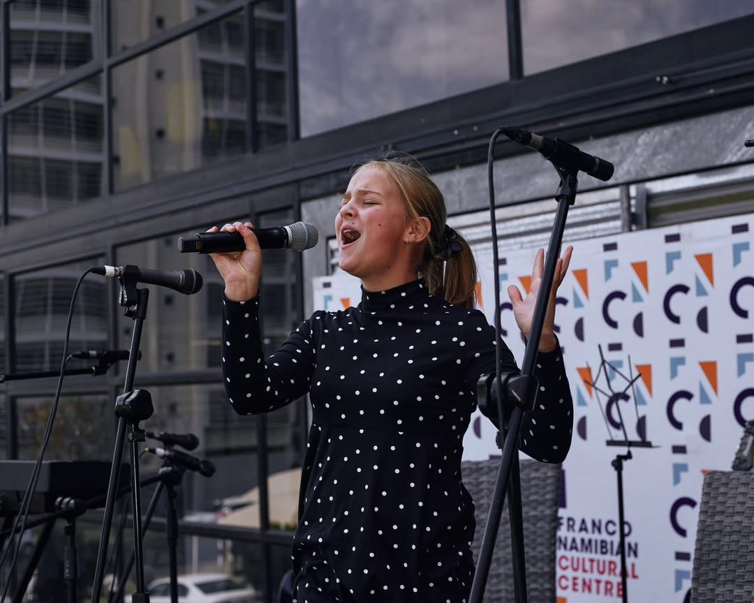 Student performing vocals on stage at Robin's Private Music Centre