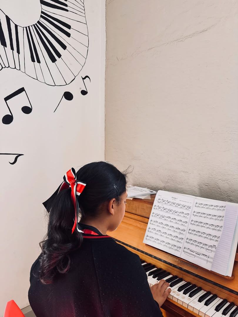 Student practising piano