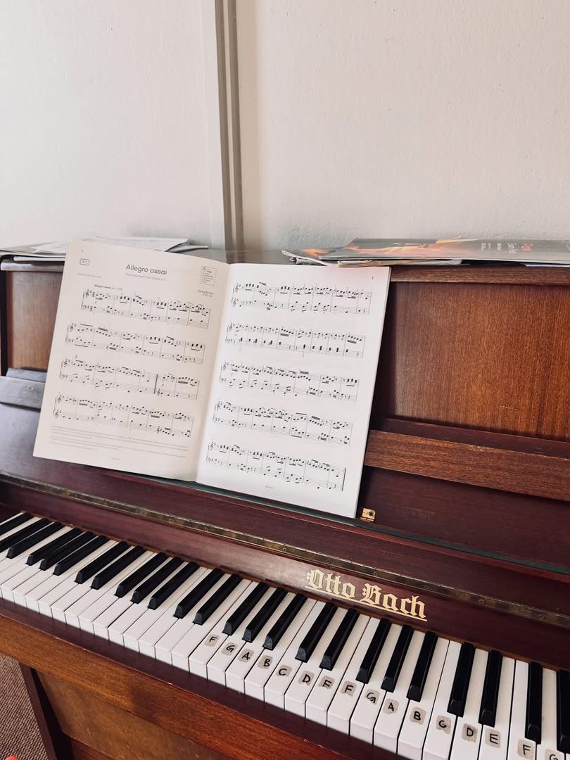 Sheet music open on a piano, prepared for practice